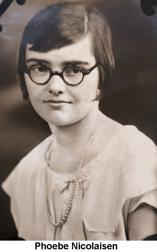 Black and white photo of a young girl with black, straight close-cropped hair, black-framed round glasses, white blouse and a pearl necklace.